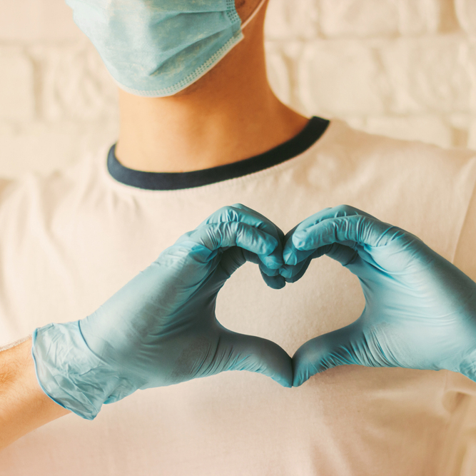 Young,Doctor,In,Protective,Gloves,And,Medical,Mask,On,Face
