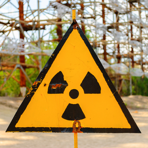 Radiation,Warning,Sign,In,Front,Of,Duga,,A,Soviet,Over-the-horizon Radiation warning sign in front of Duga, a Soviet over-the-horizon (OTH) radar system as part of the Sovietic anti-ballistic missile early-warning network, Chernobyl