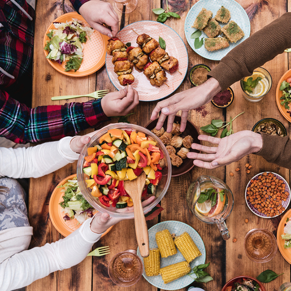 Friends,Having,Dinner.,Top,View,Of,Four,People,Having,Dinner