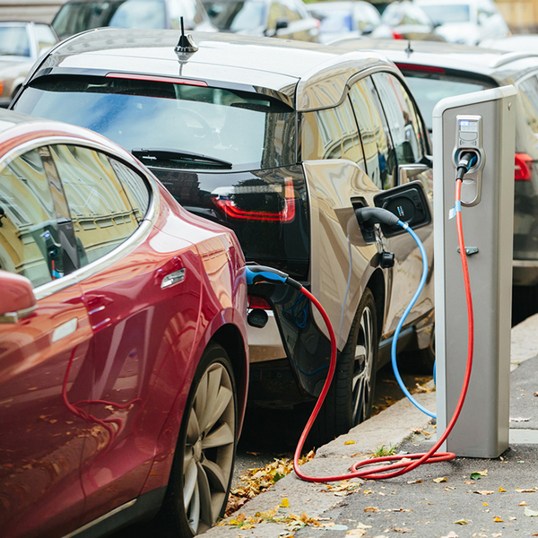 Charging,Modern,Electric,Cars,(new,Energy,Vehicles,,Nev),On,The